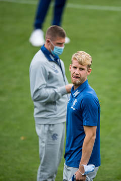 Filip Helander of Rangers inspect the pitch
