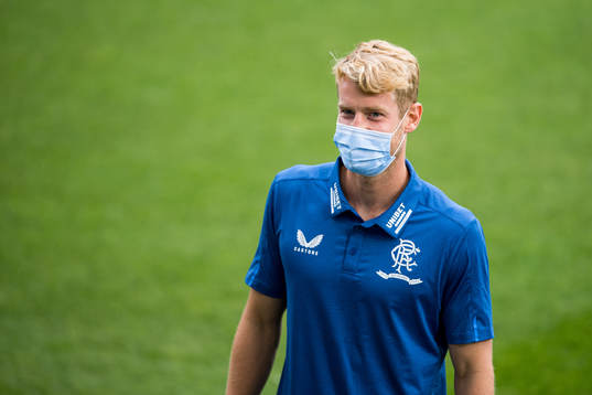 Filip Helander of Rangers inspect the pitch