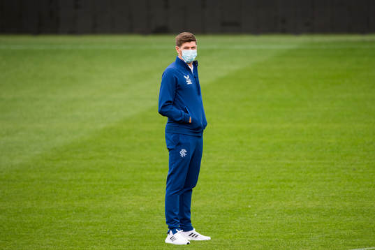 Steven Gerrard, head coach of Rangers inspect the pitch