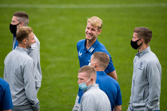 Filip Helander of Rangers inspect the pitch