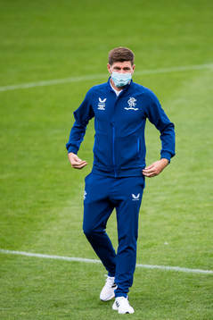 Steven Gerrard, head coach of Rangers inspect the pitch