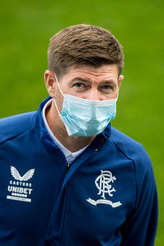 Steven Gerrard, head coach of Rangers inspect the pitch