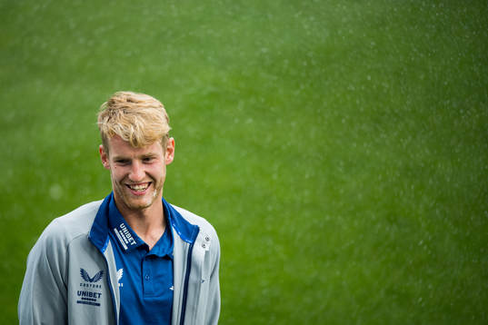 Filip Helander of Rangers inspect the pitch