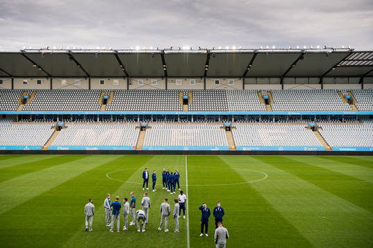Players of Rangers inspect the pitch