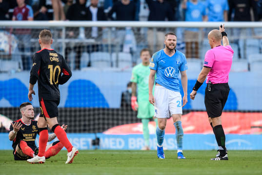 Lasse Nielsen of Malmö FF reacts against Referee Szymon