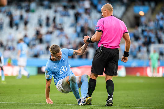 Sören Rieks of Malmö FF and Referee Szymon Marciniak