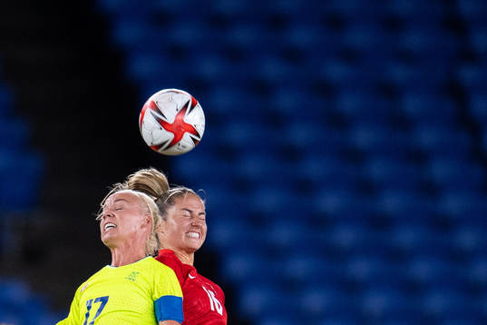 Caroline Seger of Sweden and Janine Beckie of Canada  in
