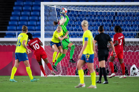 Sofia Jakobsson of Sweden and goalkeeper Stephanie Labbe of