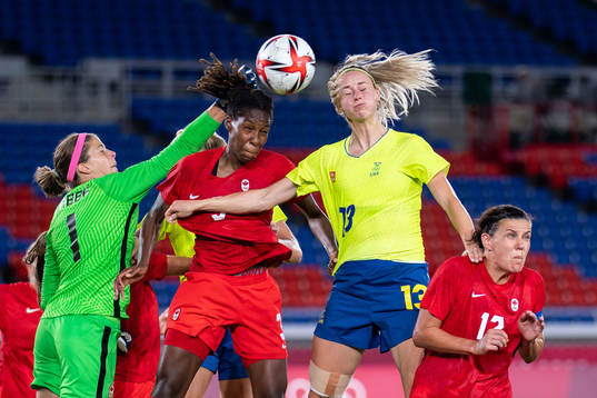 Goalkeeper Stephanie Labbe of Canada and Amanda Ilestedt of