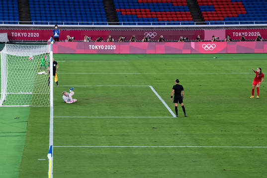Julia Grosso of Canada scores her penalty behind goalkeeper