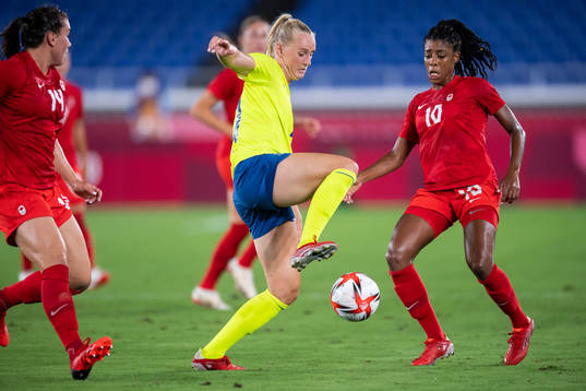Stina Blackstenius of Sweden and Ashley Lawrence of Canada