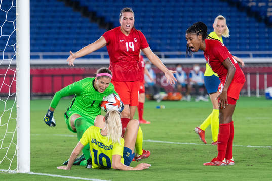 Goalkeeper Stephanie Labbe of Canada and Sofia Jakobsson of