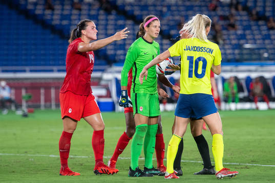 Goalkeeper Stephanie Labbe of Canada and Sofia Jakobsson of