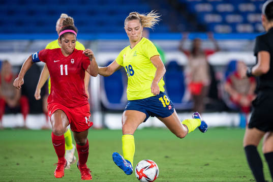 Desiree Scott of Canada and Fridolina Rolfö of Sweden  in