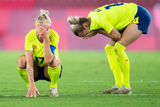 Caroline Seger and Nathalie Björn of Sweden look dejected