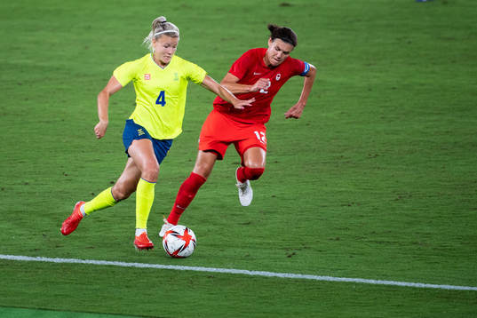 Hanna Glas of Sweden and Christine Sinclair of Canada in