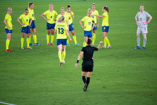 Caroline Seger of Sweden and Referee Anastasia Pustovoitova