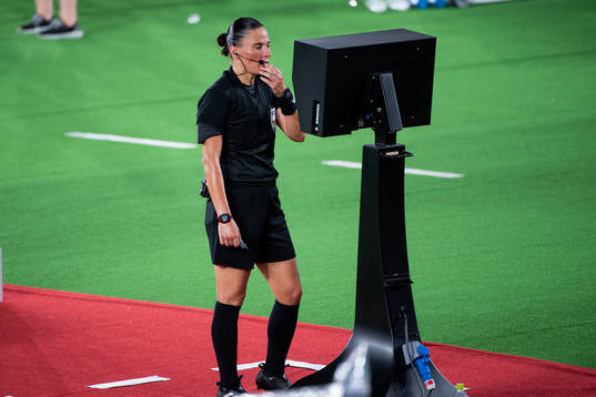 Referee Anastasia Pustovoitova looks at a VAR screen in the