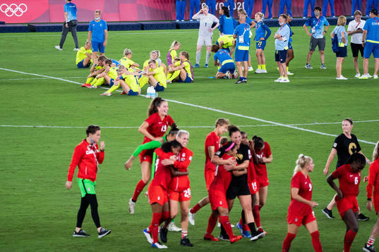 Players of Sweden looks dejected and players of Canada