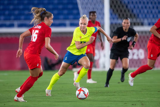 Caroline Seger of Sweden and Janine Beckie of Canada in the