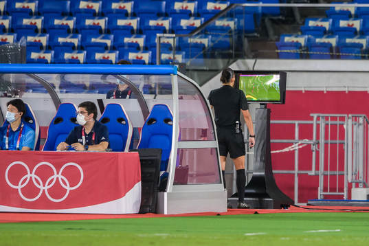 Referee Anastasia Pustovoitova looking at a VAR situation