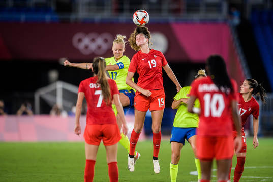 Caroline Seger of Sweden and Jordyn Huitema of Canada in