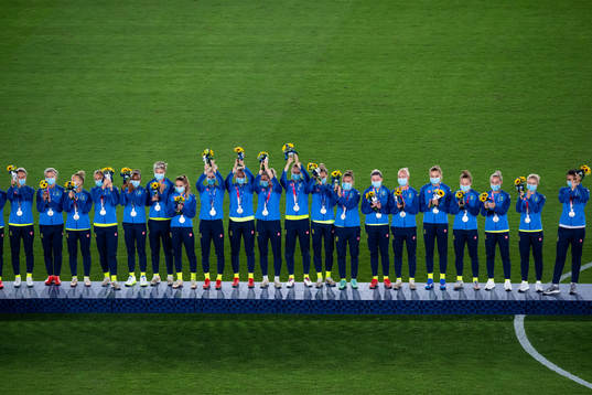 Players of Sweden at the podium at the medal ceremony