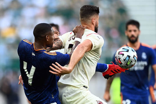 Olivier Giroud of Milan and David Alaba of Real Madrid