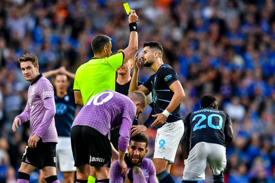 Bonke Innocent of Malmö FF receives his second yellow card
