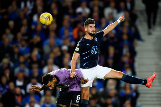 Antonio Colak of Malmö FF and Connor Goldson of Rangers