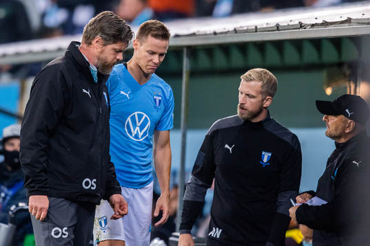 Niklas Moisander of Malmö FF leaves the pitch due to injury