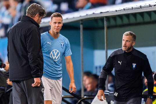 Niklas Moisander of Malmö FF leaves the pitch due to injury