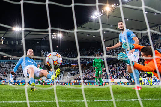 Jo Inge Berget of Malmö FF scores 2-0 behind goalkeeper