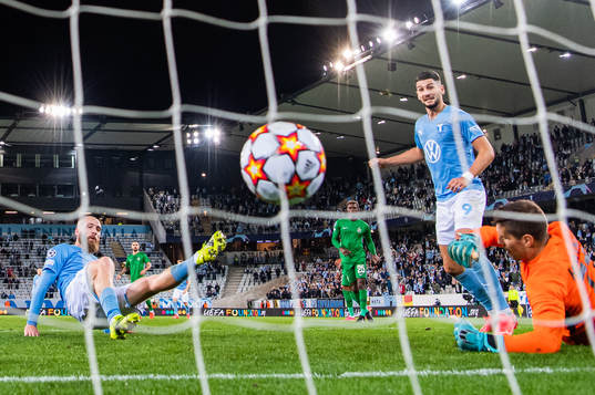 Jo Inge Berget of Malmö FF scores 2-0 behind goalkeeper