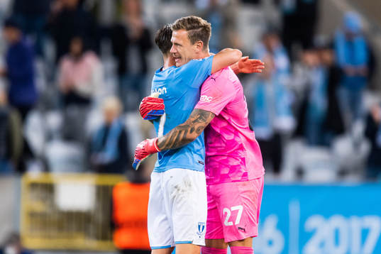 Eric Larsson and goalkeeper Johan Dahlin of Malmö FF