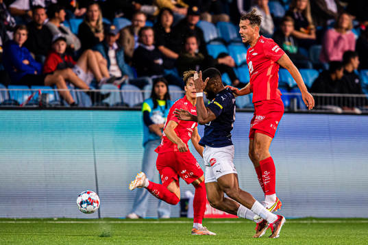 Imoh Fred Friday of Strømsgodset and Fredrik Pallesen