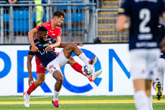 Fredrik Pallesen Knudsen of Brann and Imoh Fred Friday of