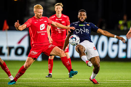 Sivert Heltne Nilsen of Brann and Imoh Fred Friday of