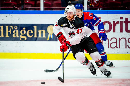 Malmö Redhawks Joakim Ryan och Oskarshamns Fredrik Olofsson