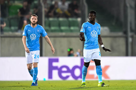 Lasse Nielsen and Bonke Innocent of Malmö FF look dejected