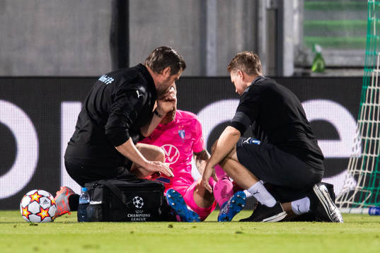 Goalkeeper Johan Dahlin of Malmö FF receives medical