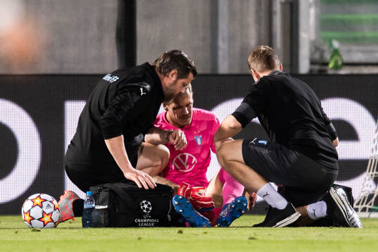 Goalkeeper Johan Dahlin of Malmö FF receives medical