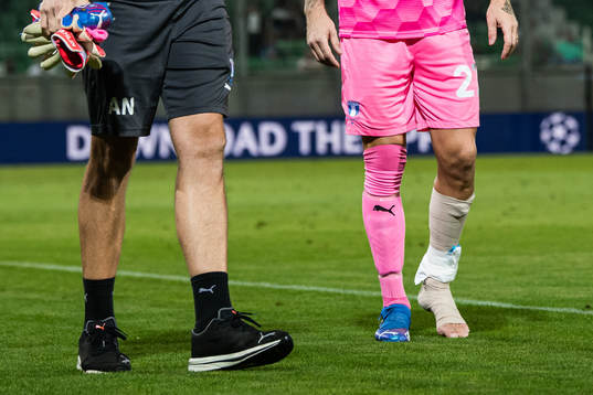 Goalkeeper Johan Dahlin of Malmö FF with a injured foot
