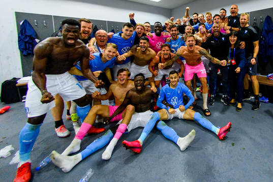 Players of Malmö FF celebrate in the locker room