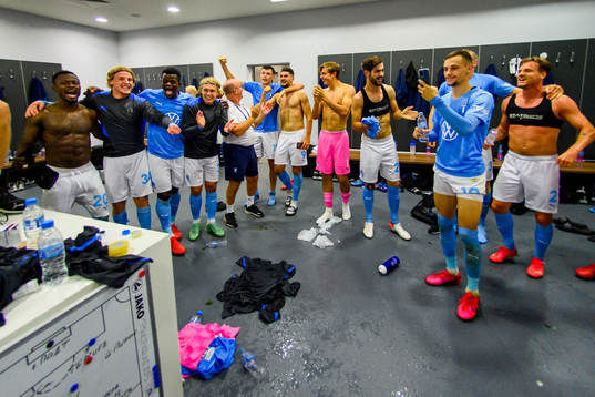 Players of Malmö FF celebrate in the locker room