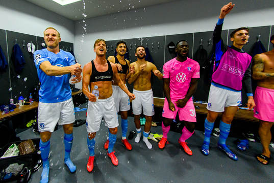Players of Malmö FF celebrate in the locker room