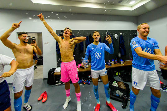 Players of Malmö FF celebrate in the locker room