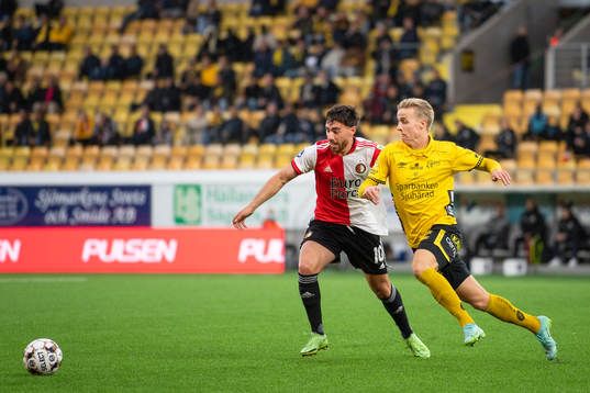 Orkun Kokcu of Feyenoord and Jeppe Møldrup Okkels of