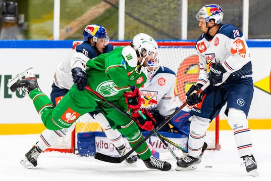 Dennis Everberg of Rögle compete with Maximilian Daubner