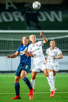 Tine Lea De Caigny of Hoffenheim and Caroline Seger of
